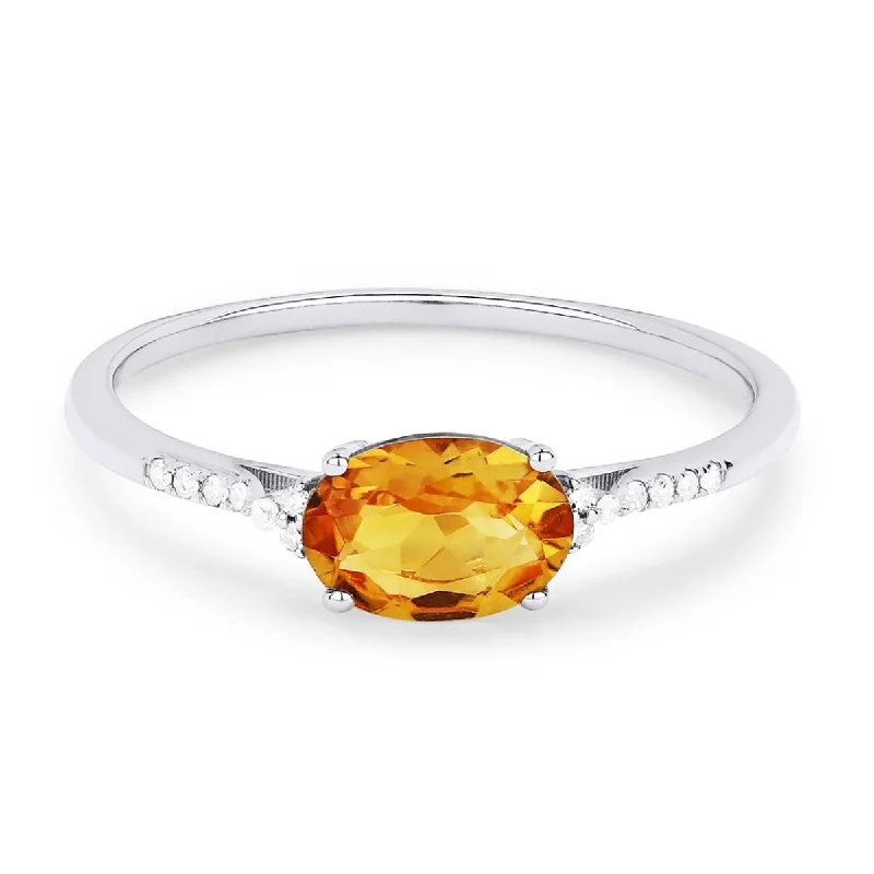 simple ladies rings with diamonds-OVAL CUT CITRINE AND DIAMOND RING, .04 CT TW