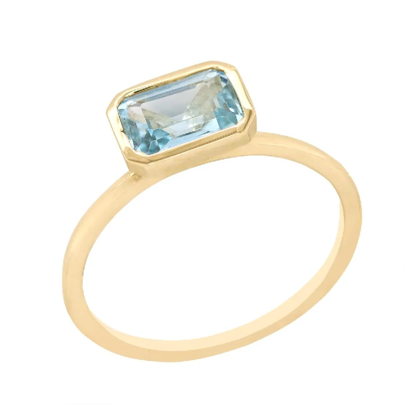 fashion rings for ladies-YELLOW GOLD FASHION RING WITH EMERALD CUT BLUE TOPAZ